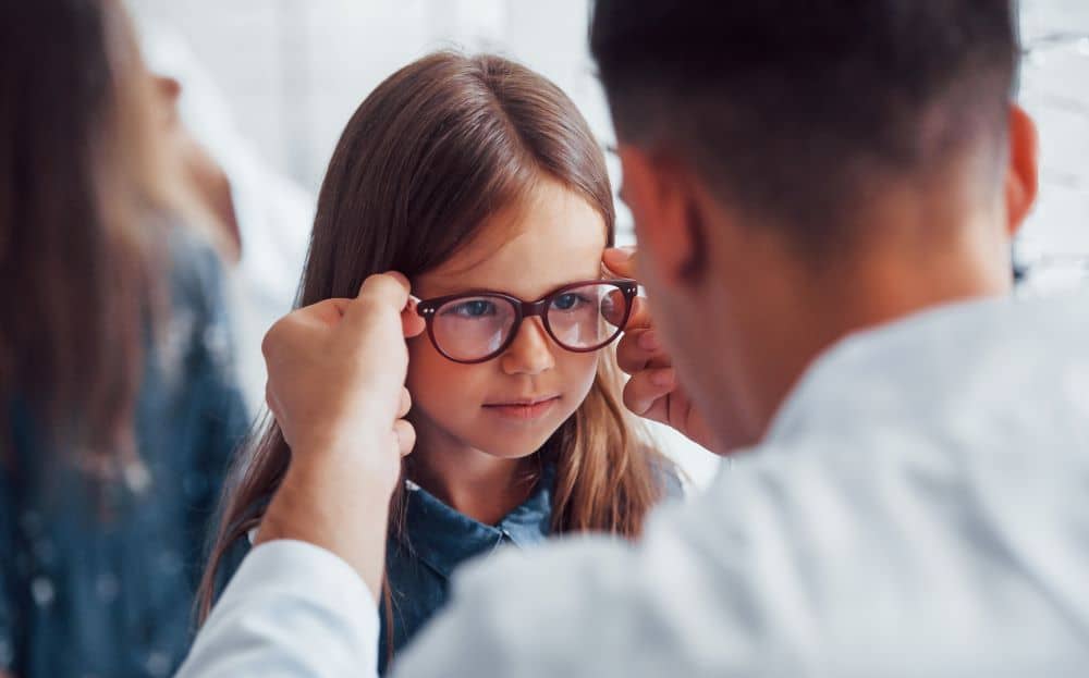 Young girl wearing eyeglasses.