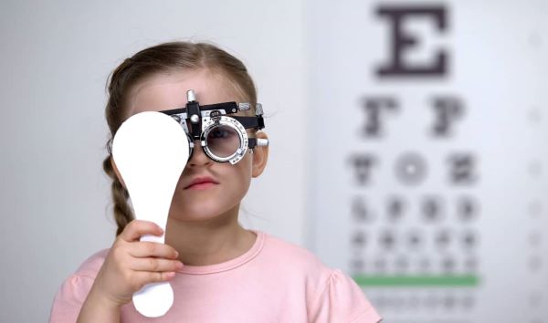 Little girl during eye check-up. 